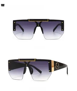 Front and side view of shield sunglasses with golden deer emblem and gradient lenses