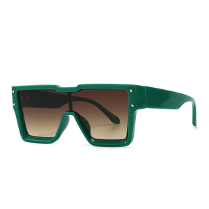 Oversized dark green resin sunglasses with gradient lenses and gold metal studs