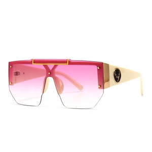 Modern oversized pink gradient sunglasses with ivory temples and golden deer head logo