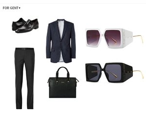 Flat lay of business suit with retro square sunglasses featuring 'FASHION' lettering