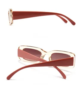 Detailed side and back view of retro square sunglasses with champagne frames and wide red legs