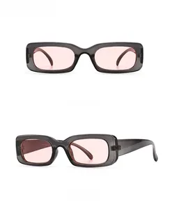 Front and side view of retro rectangular sunglasses in grey pink finish and resin lenses