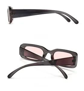 Side and rear view of vintage translucent grey rectangle sunglasses with pink lenses