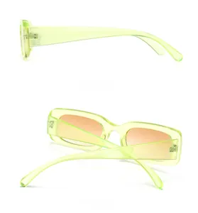 Side and back views of trendy rectangle sunglasses with light green frames and orange lenses