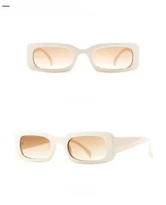Front and side view of rectangular retro sunglasses with pale yellow frames and brown lenses