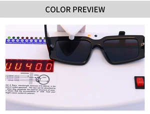 Testing UV400 protection performance of black square sunglasses on a digital sensor