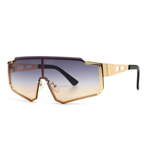 Modern oversized metal wrap-around sunglasses with gradient brown lenses and gold frames