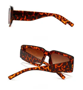 Detail view of tortoiseshell sunglasses featuring wide temples and brown tinted lenses