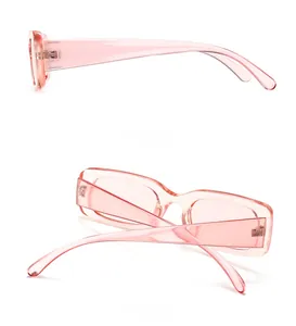 Side and back view of retro rectangle sunglasses featuring pink transparent frames