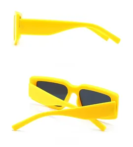 Side and back view of retro yellow rectangular sunglasses with wide temples