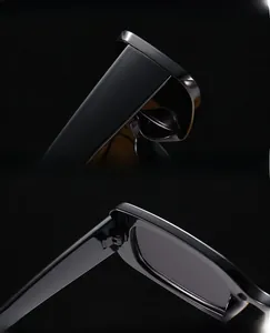 Detail view of reinforced metal hinges and UV protection lenses on black sunglasses
