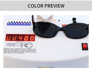 Occhiali da sole ovali moderni su tester UV400 che mostra la protezione totale