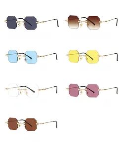 Flat lay of small octagonal rimless sunglasses in seven fashion colors with gold metal temples