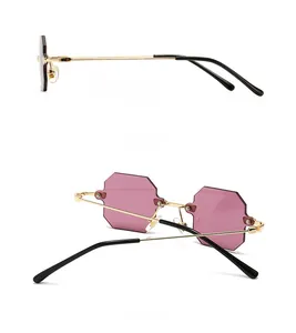 Side and back view of rimless purple octagonal sunglasses with gold metal temples