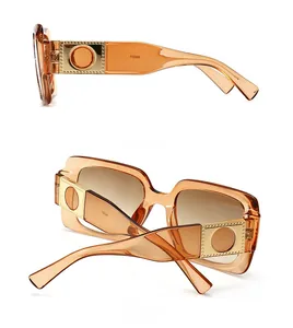 Side and back view of retro amber square sunglasses with golden metal temple detail