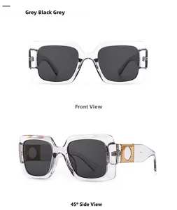 Detail of square sunglasses with transparent grey frames and gold hollow temple decor