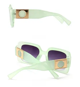 Side and back view of mint green square sunglasses with gold metal temple accents