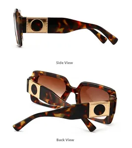 Detail view of tortoiseshell square sunglasses with gold accents and gradient lenses