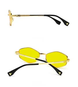 Detailed side and back view of hexagonal sunglasses with yellow lenses and metal logo