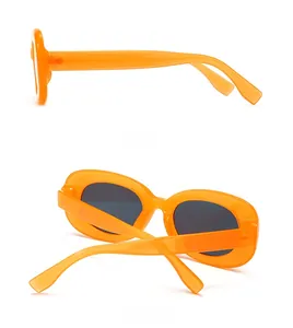 Side and back view of retro oval sunglasses with orange frame and black lenses