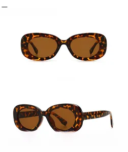Front and 45-degree side view of vintage leopard print oval frame sunglasses with tan lenses