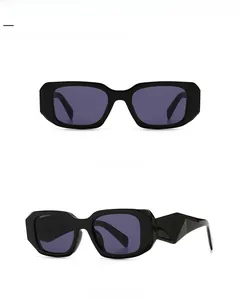 Detail view of modern retro rectangular sunglasses with geometric faceted temples and dark lenses