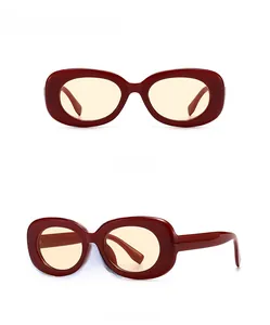 Front and 45-degree side view of vintage red oval sunglasses with light tan lenses