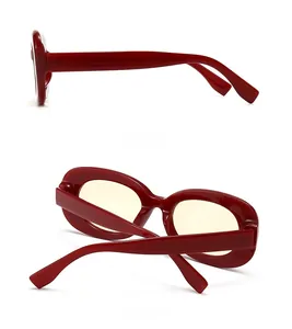 Side and back view of retro red thick frame sunglasses with yellow lenses