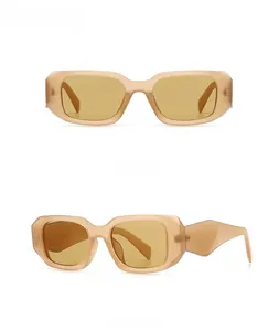 Detail of modern rectangular sunglasses with thick amber frames and geometric wide temples