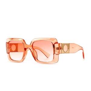 Modern retro square sunglasses with transparent orange frame and gradient lenses