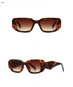 Detail view of leopard tortoise shell sunglasses with gradient brown lenses and rectangle frame