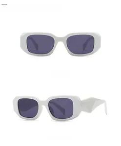 Detail view of white rectangle sunglasses with geometric wide frames and dark grey lenses