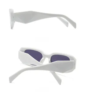 Detail view of white square sunglasses showing geometric faceted temple design