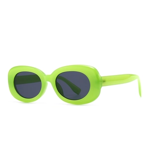 Retro fluorescent green oval frame sunglasses with dark grey lenses and thick temples