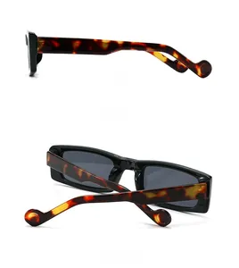 Detailed side and back view of rectangular sunglasses with tortoiseshell temples
