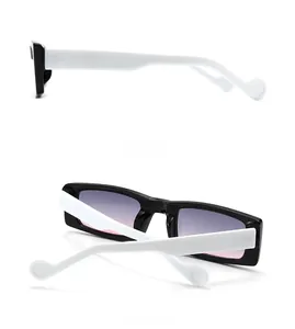 Detail view showing side and back of rectangular sunglasses with black frames and white temples