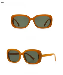Détail des lunettes de soleil rétro avec monture ovale épaisse couleur ambre