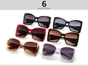 Six assorted cat-eye sunglasses with gradient lenses in various vibrant frame colors