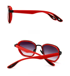 Detail view of red and black square sunglasses showing side and back frame structure