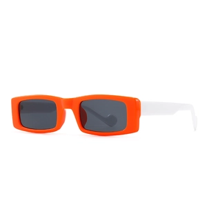 Modern retro rectangle sunglasses with orange frames and contrasting white temples on white background