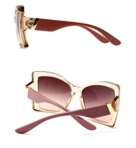 Side and back view of tortoiseshell butterfly sunglasses with golden metal hinges