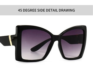 Close-up of modern black cat-eye sunglasses with gold accents and gradient lenses
