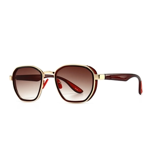 Modern square sunglasses with gold and black frames and brown gradient lenses