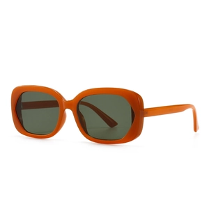 Lunettes de soleil ovales rétro avec monture orange vif et verres foncés style urbain
