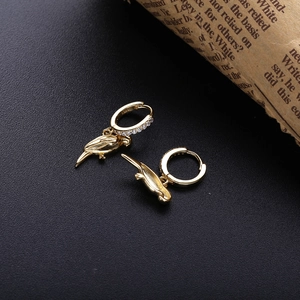 S925 gold parrot pendant earrings with sparkling white micro-diamonds on black texture