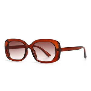 Lunettes de soleil ovales rétro ambre avec verres dégradés marron et monture épaisse