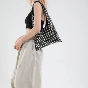Gothic style black hobo bag with silver rivets and studs for street fashion
