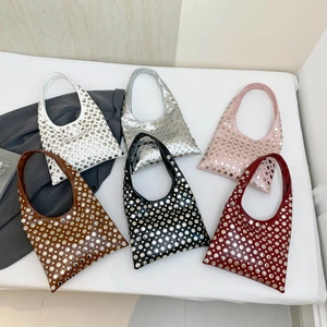Gothic rivet underarm bags in six colors with metallic studs and punk aesthetic