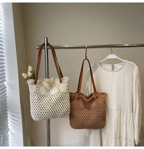 Close-up of crochet hollow tote bag featuring intricate flower petal knit patterns