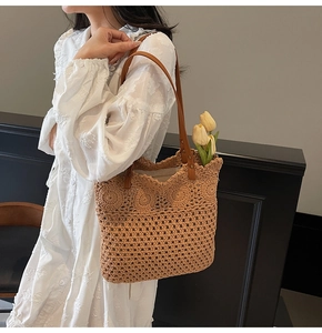 Detailed crochet patterns with sunflower accents and leather handles on summer tote bag